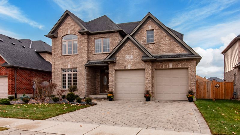 HDR exterior photo of a two-storey brick home, angled view